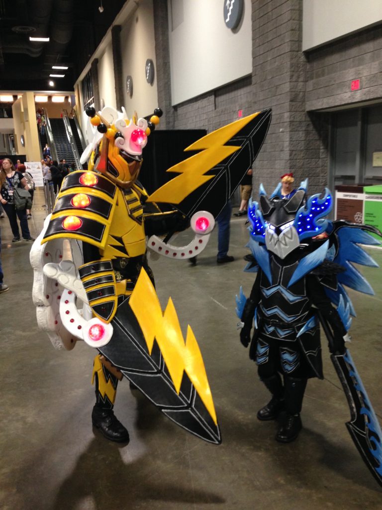 A father and son as two characters from Pokemon monster Hunter Crossover. Nice to see cosplay as a family affair.
