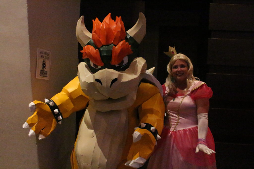 Bowser is escoring Princess Peach. Nothing unusual about that.