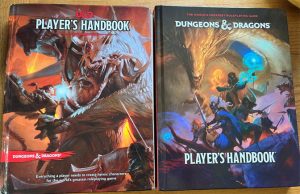 The well-used copy of the older Players handbook (left) and the brand new tome sitting beside it.